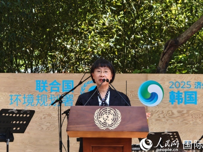 周國(guó)梅致辭。人民網(wǎng)記者 李明攝